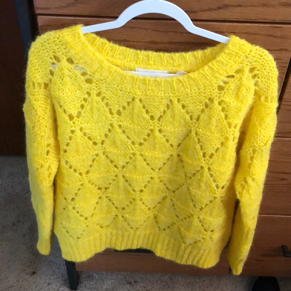 Bright yellow knitted sweater
